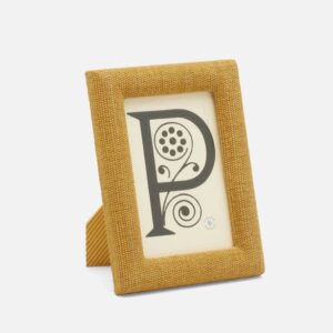 A decorative yellow frame displays a stylized letter "P" with floral designs.