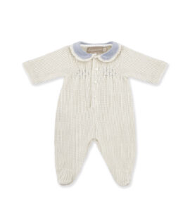 Cream-colored baby onesie with short sleeves, a blue collar, and decorative embroidery.