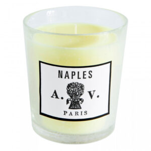 A glass candle with a yellow wax interior and a label reading "Naples A.V. Paris.