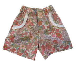 Floral-patterned shorts with white trim and pockets, designed for girls.