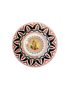 Ceramic plate featuring intricate red, black, and white patterns with a central owl design.