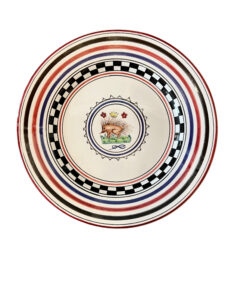 Ceramic plate featuring colorful concentric stripes and a central illustration of a hedgehog.