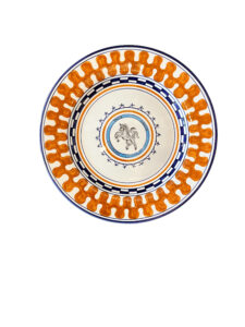 Ceramic plate with orange and blue patterns, featuring a rearing horse in the center.