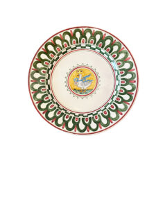 Ceramic plate with intricate green and red patterns, featuring a central illustration of a duck.