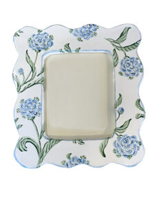 Decorative picture frame with blue hydrangea designs and a blank center for a photo.