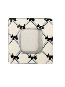 Miniature picture frame decorated with black Scotty dog patterns on a white background.