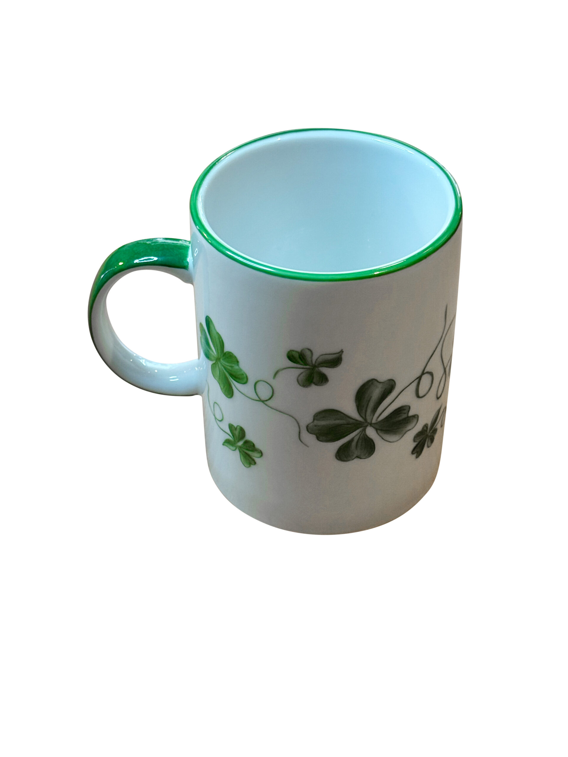magdalena-s-palette-mug-in-clover-green Clover green mug with a white body, featuring green clover designs and a matching rim.