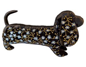 Black velvet dachshund plush with blue and yellow floral embroidery.