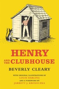 A boy stands in a clubhouse doorway with a dog beside him, set against a bright yellow background.