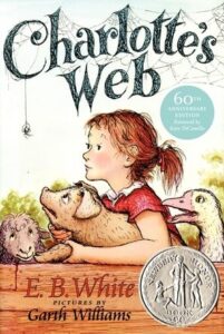 A girl interacts with a pig and sheep, surrounded by a spider web. Book title and author displayed.