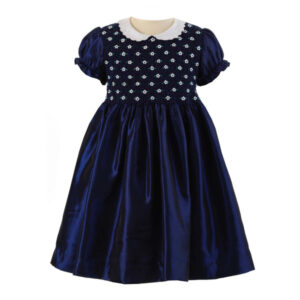 Navy blue dress with puff sleeves and a white collar, featuring floral embroidery on the bodice.