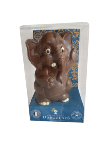 Chocolate elephant figure in a clear box, featuring large eyes and a playful pose.