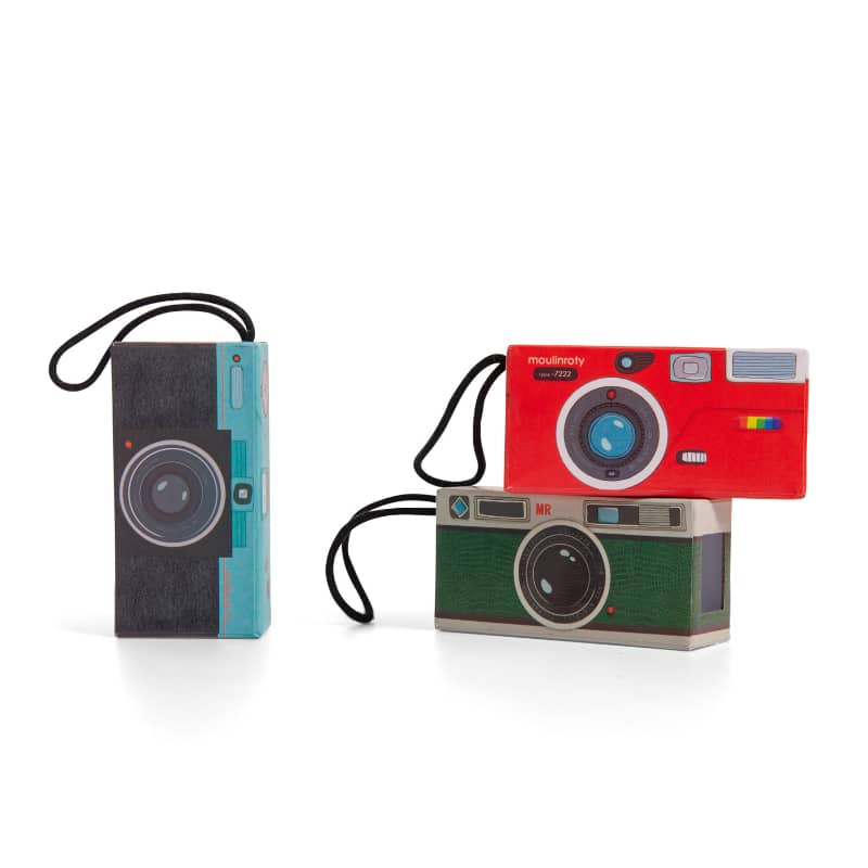 Three toy cameras in various colors stacked together, featuring playful designs and straps.